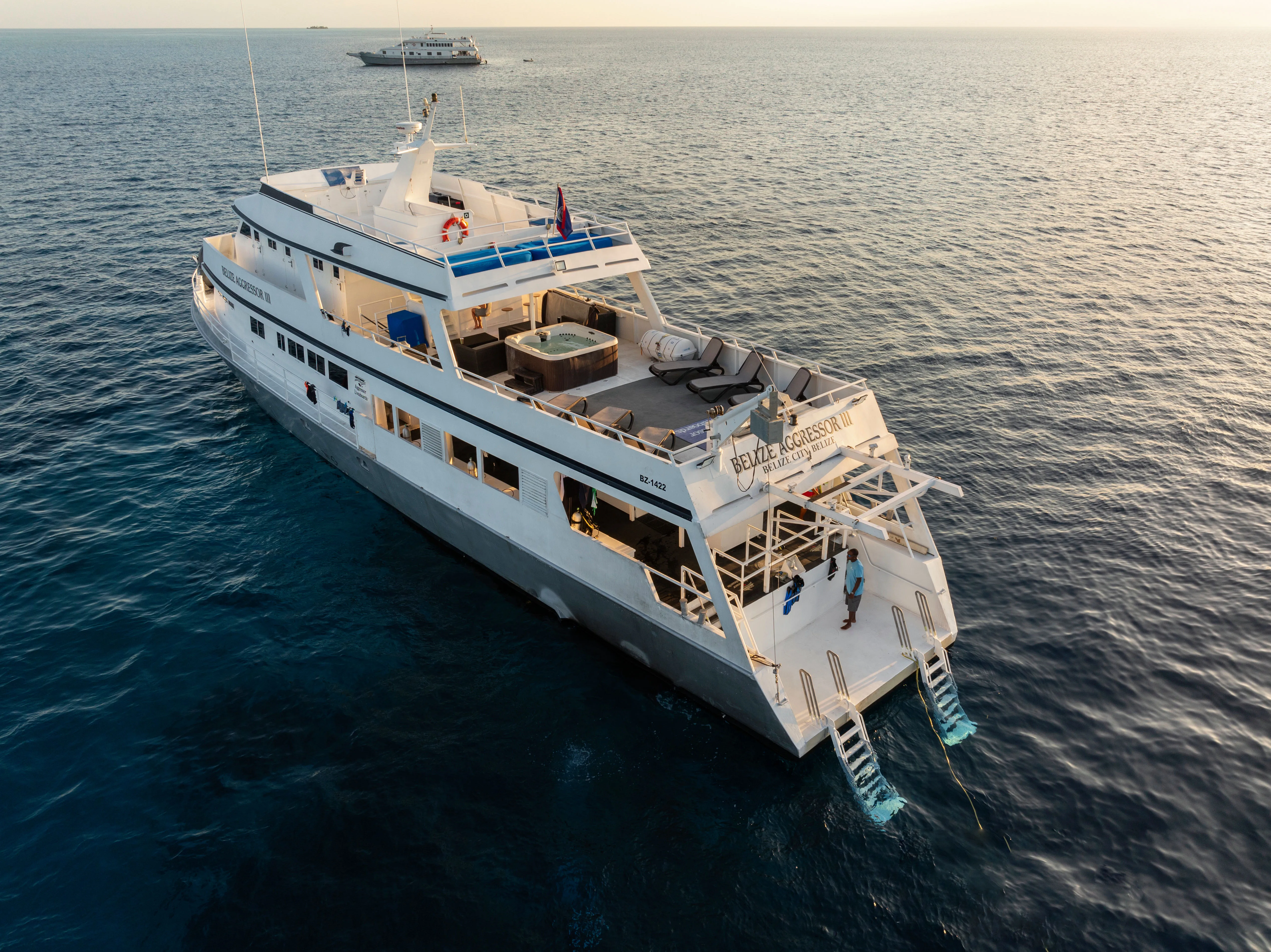 Belize Aggressor III from the air at sunset, dive platform and ladders