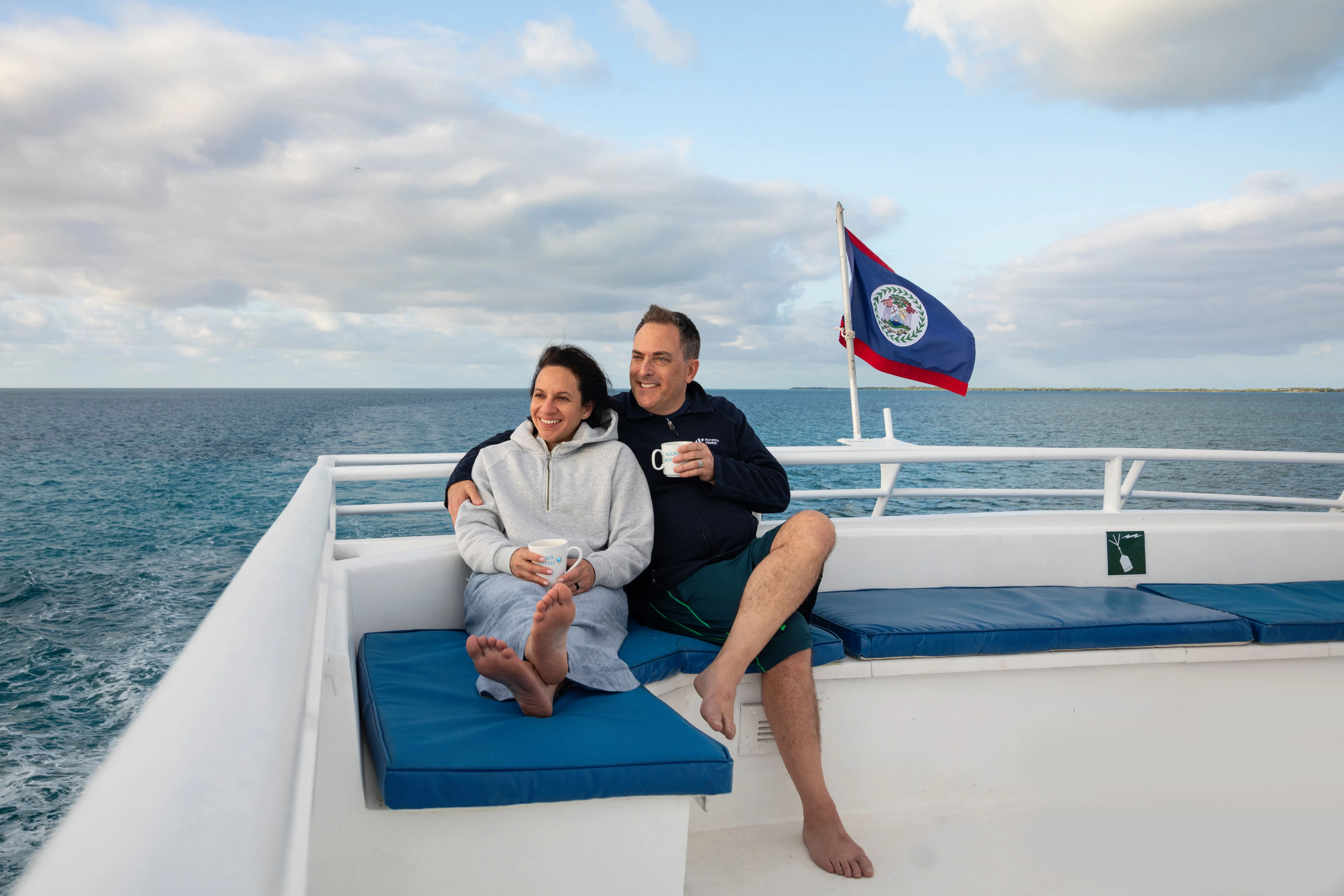Guests on the sun deck of Belize Aggressor III under the Belize flag