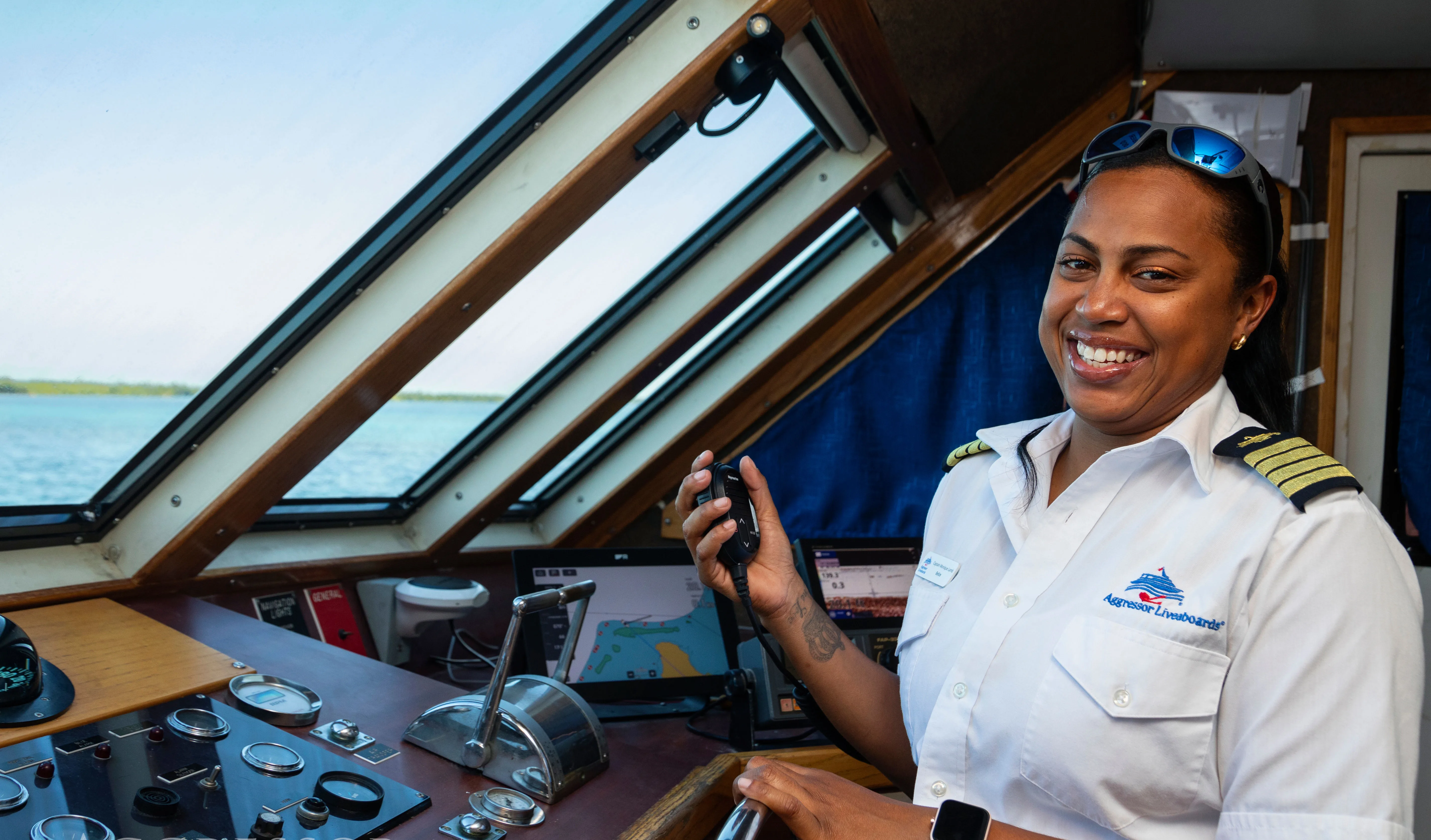 The captain of Belize Aggressor III in the wheelhouse