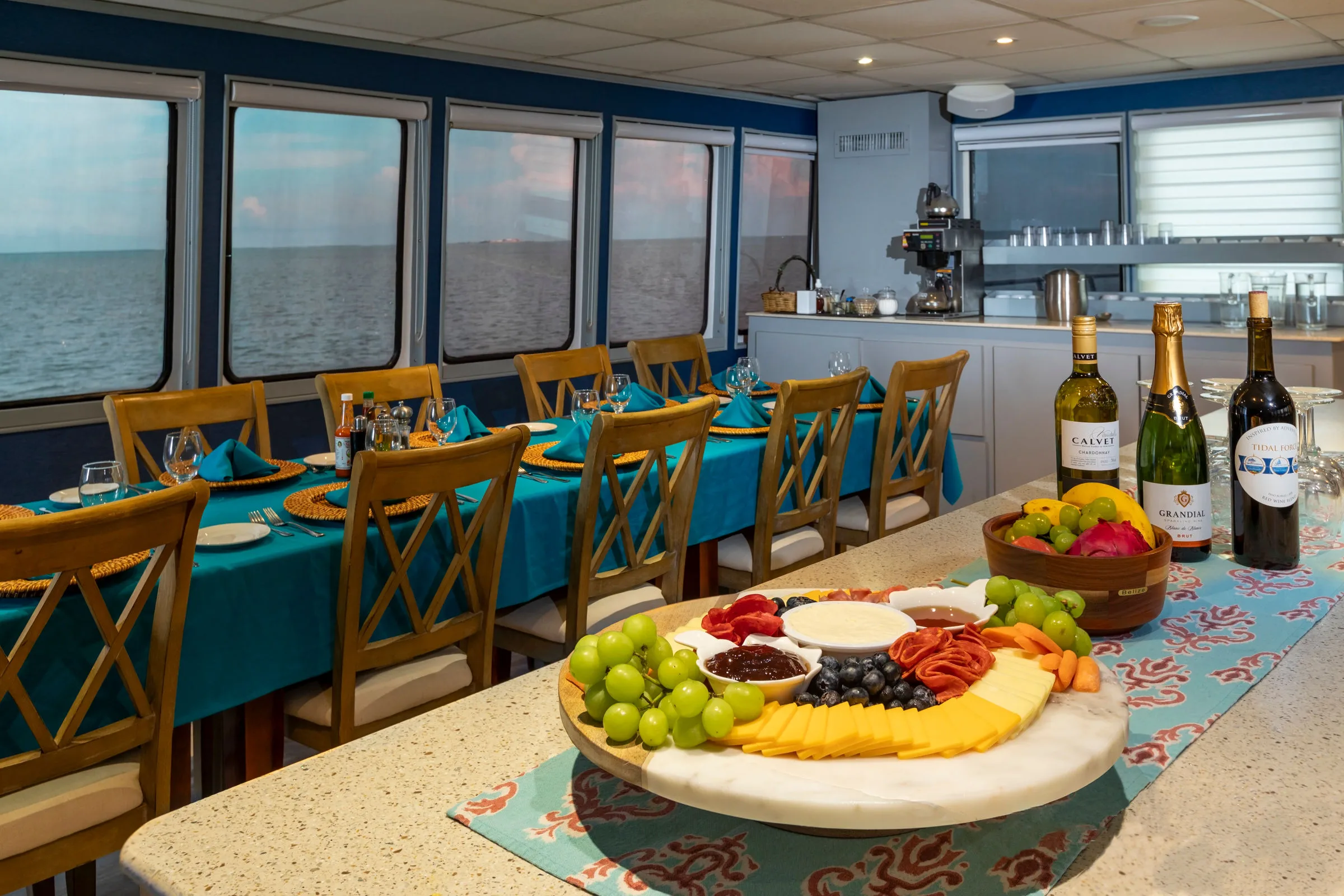 Laid tables and the galley counter in the salon