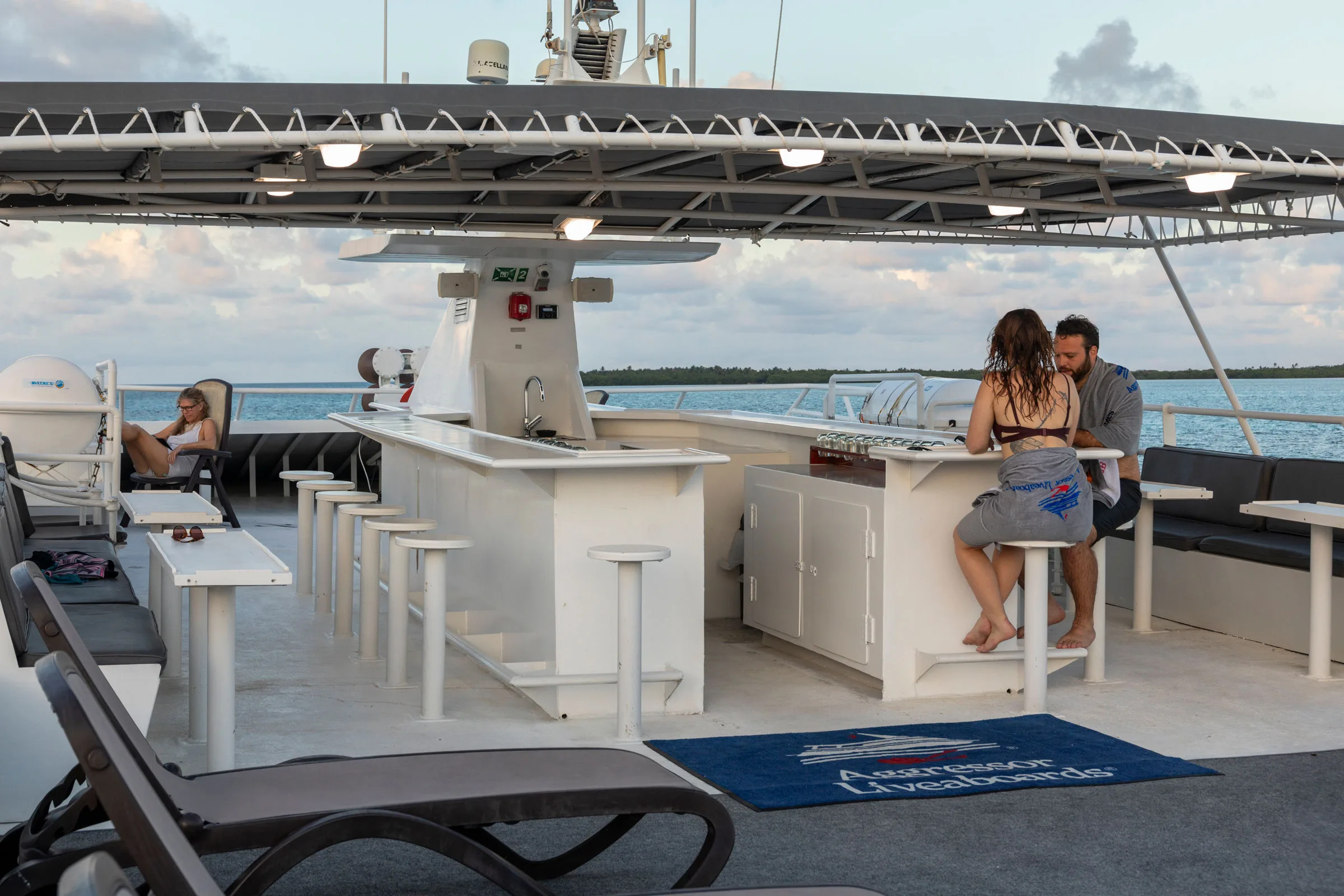Shaded upper sun deck with loungers