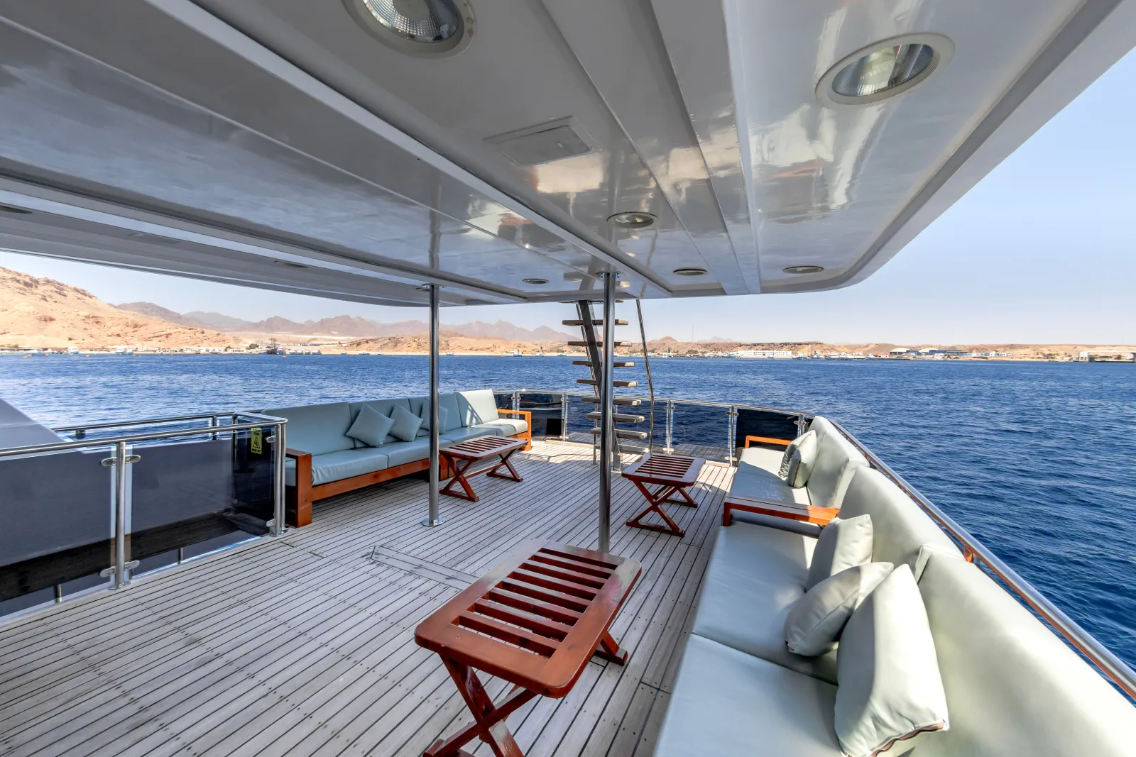 Shaded deck on Bella 3 and the stairs to the sun deck