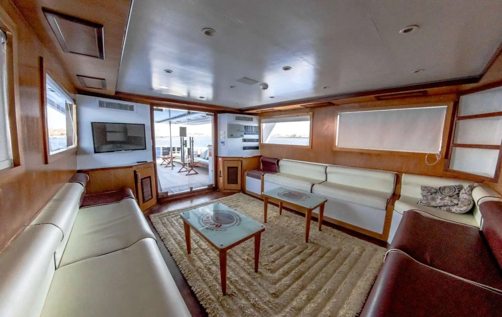 Bella 3 salon with a TV and the door out to the deck