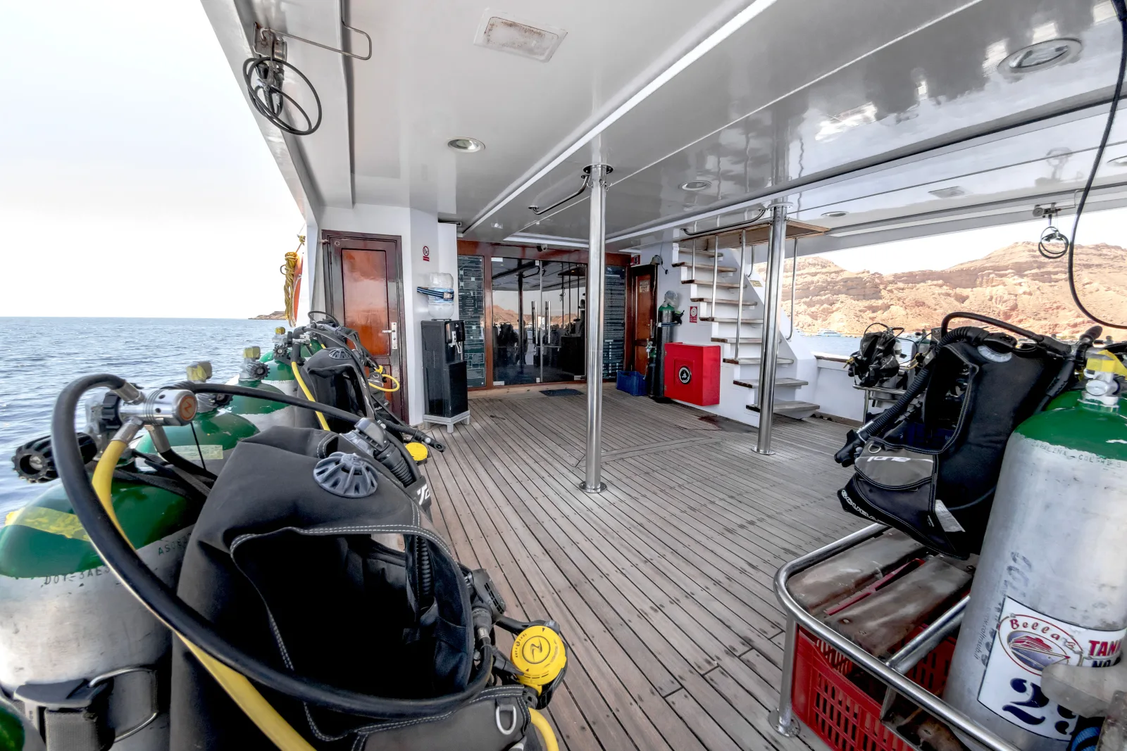 Bella 3 dive deck — tanks and gear along the sides