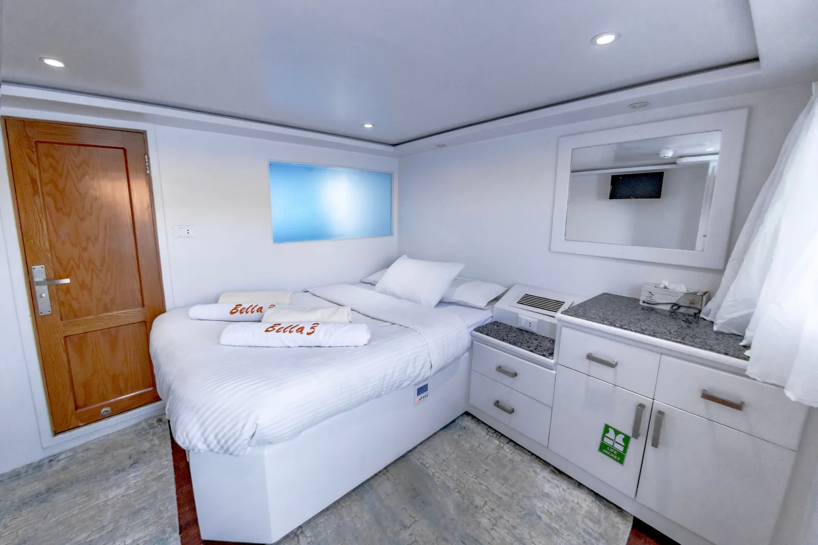 Bella 3 upper-deck double cabin — double bed and a TV