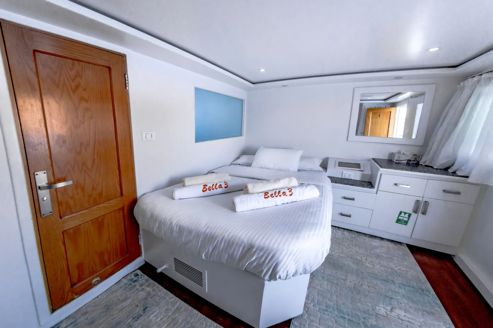Bella 3 double cabin — wooden door, bed and chest of drawers