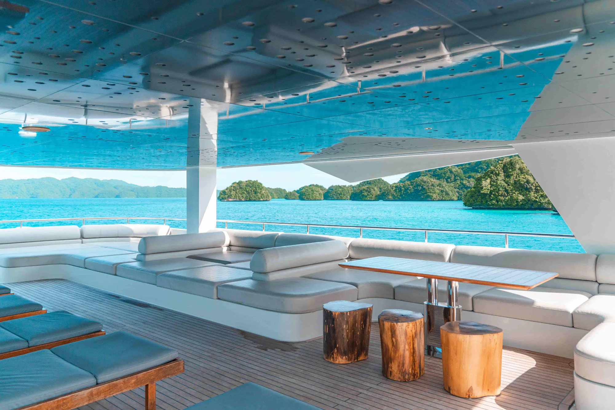 Sun beds on the Black Pearl sun deck facing green islands