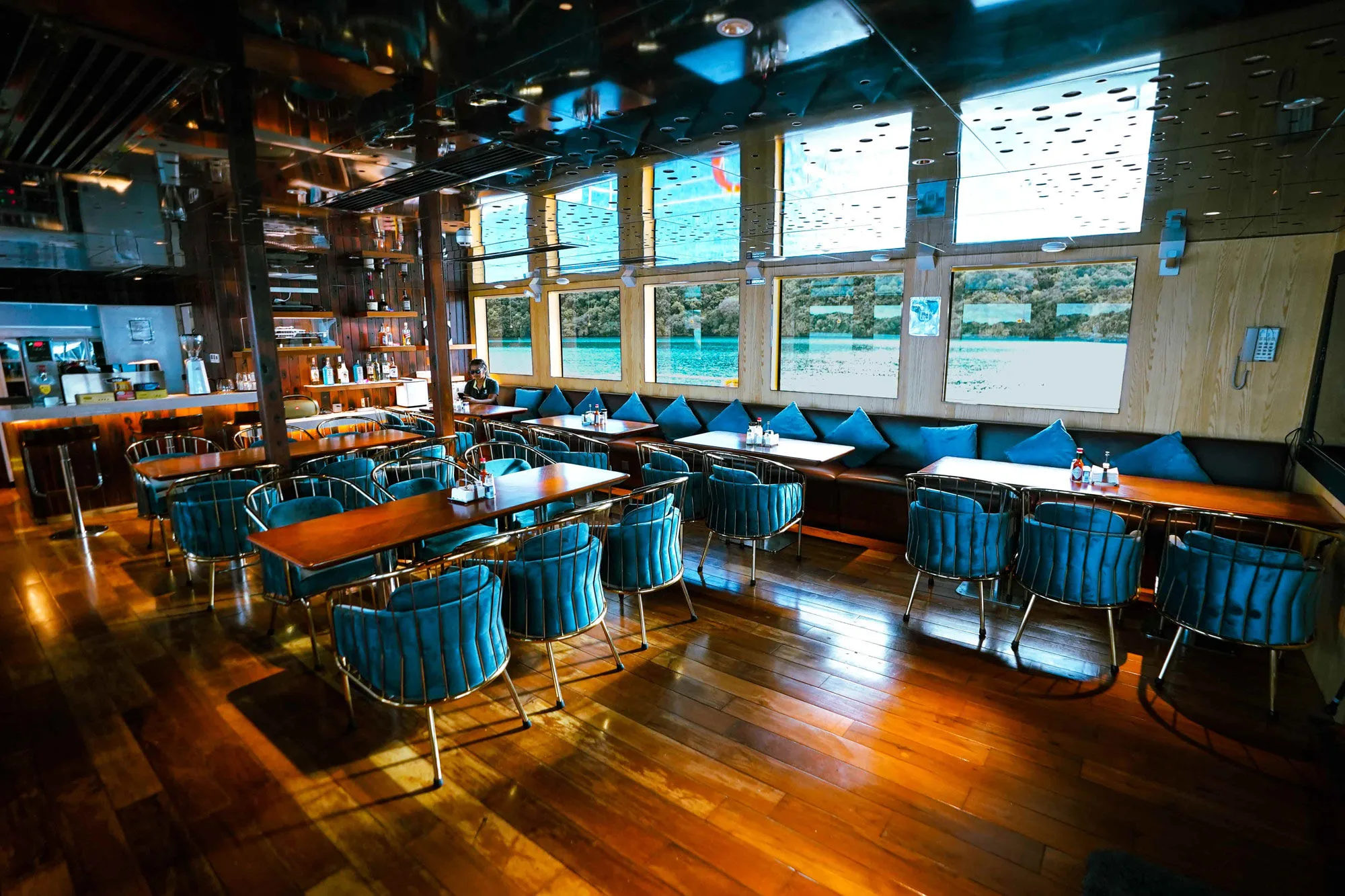 Black Pearl restaurant with panoramic windows and turquoise chairs