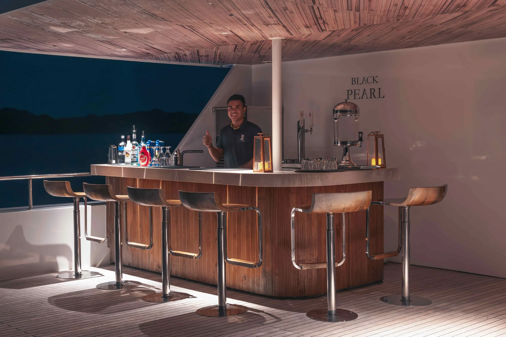 Bartender mixing drinks at the Black Pearl bar