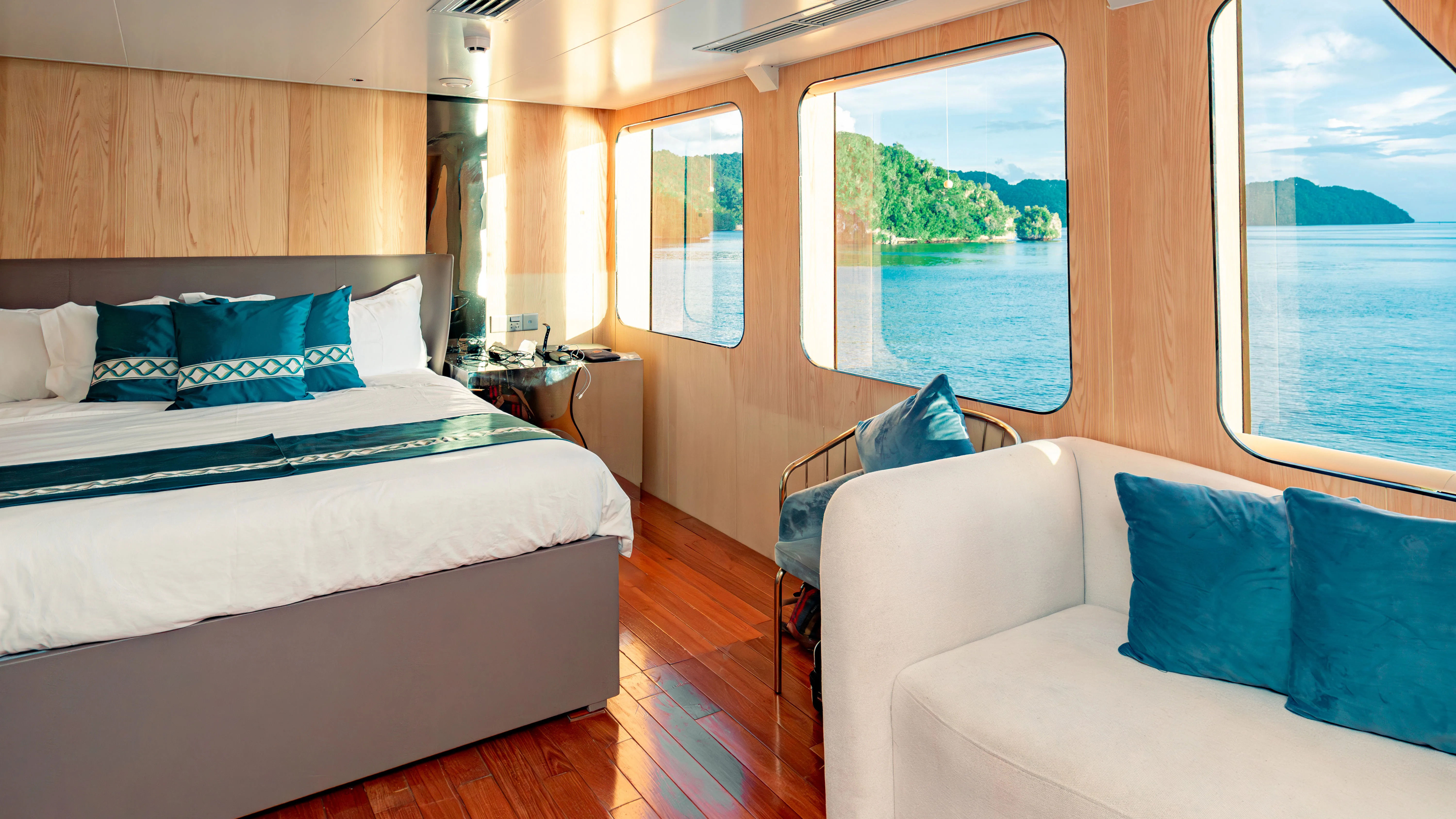 Master Seaview cabin on Black Pearl with a sofa by the panoramic windows