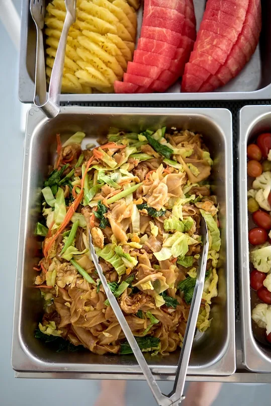 Buffet on board — Thai noodles, fresh vegetables and fruit