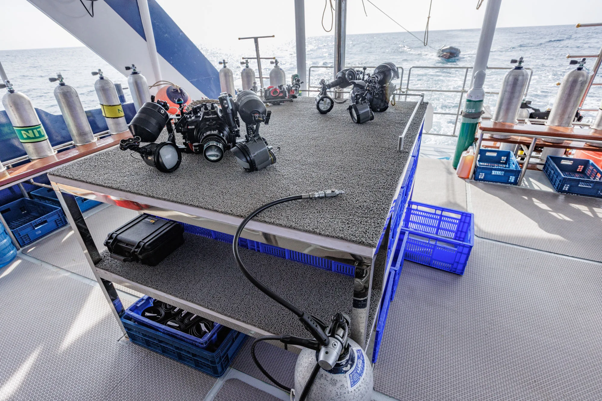 Camera table with underwater housings and a charging station