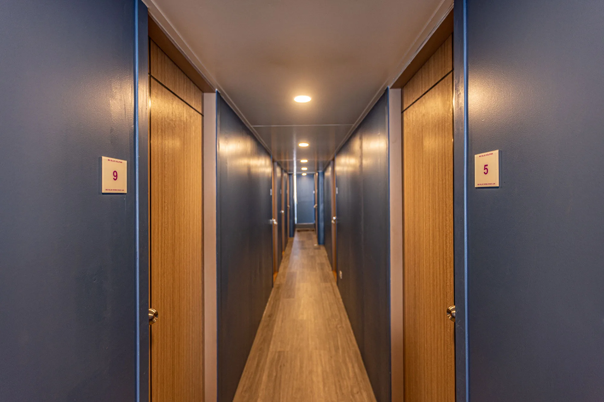 Corridor with numbered cabin doors