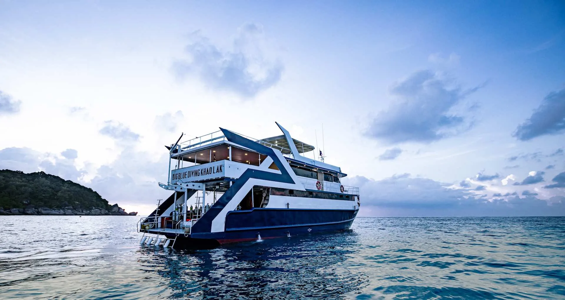 The boat moored off the Similans at dusk