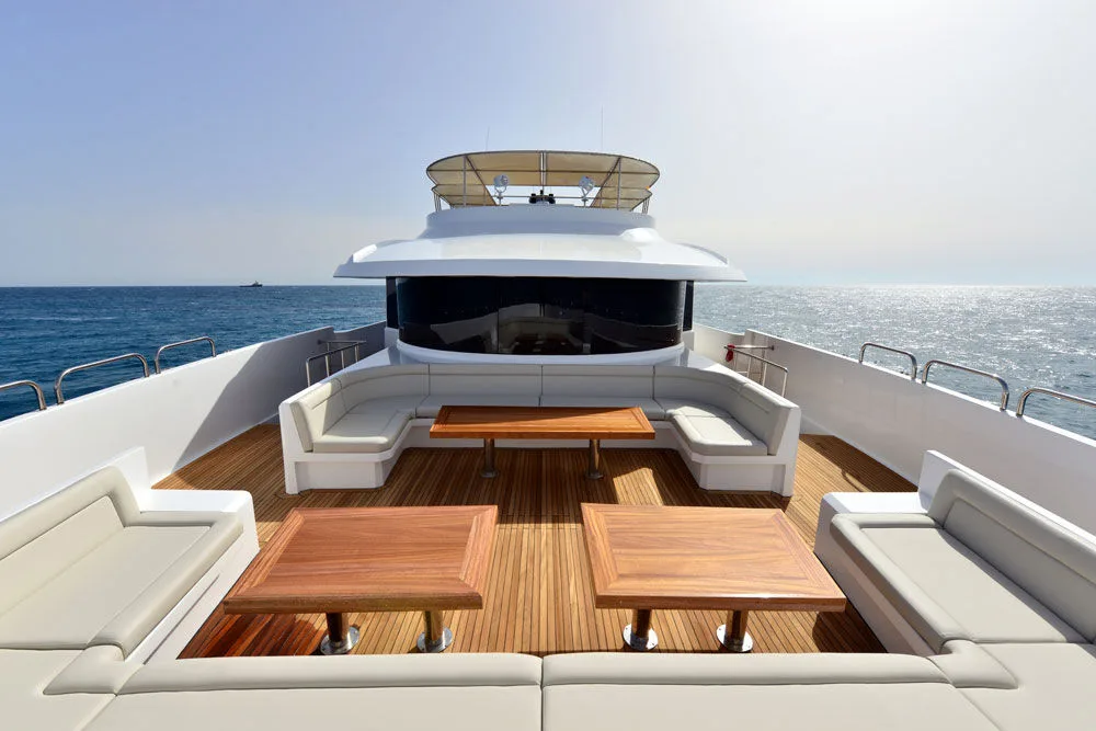 Open deck with sofas and tables at sunset
