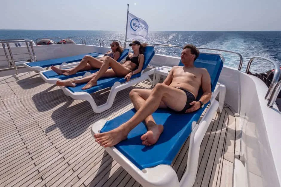 Sun loungers on the sun deck and the Blue Planet flag
