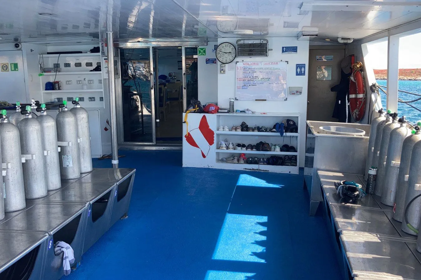 Calipso dive deck with tanks and gear shelves