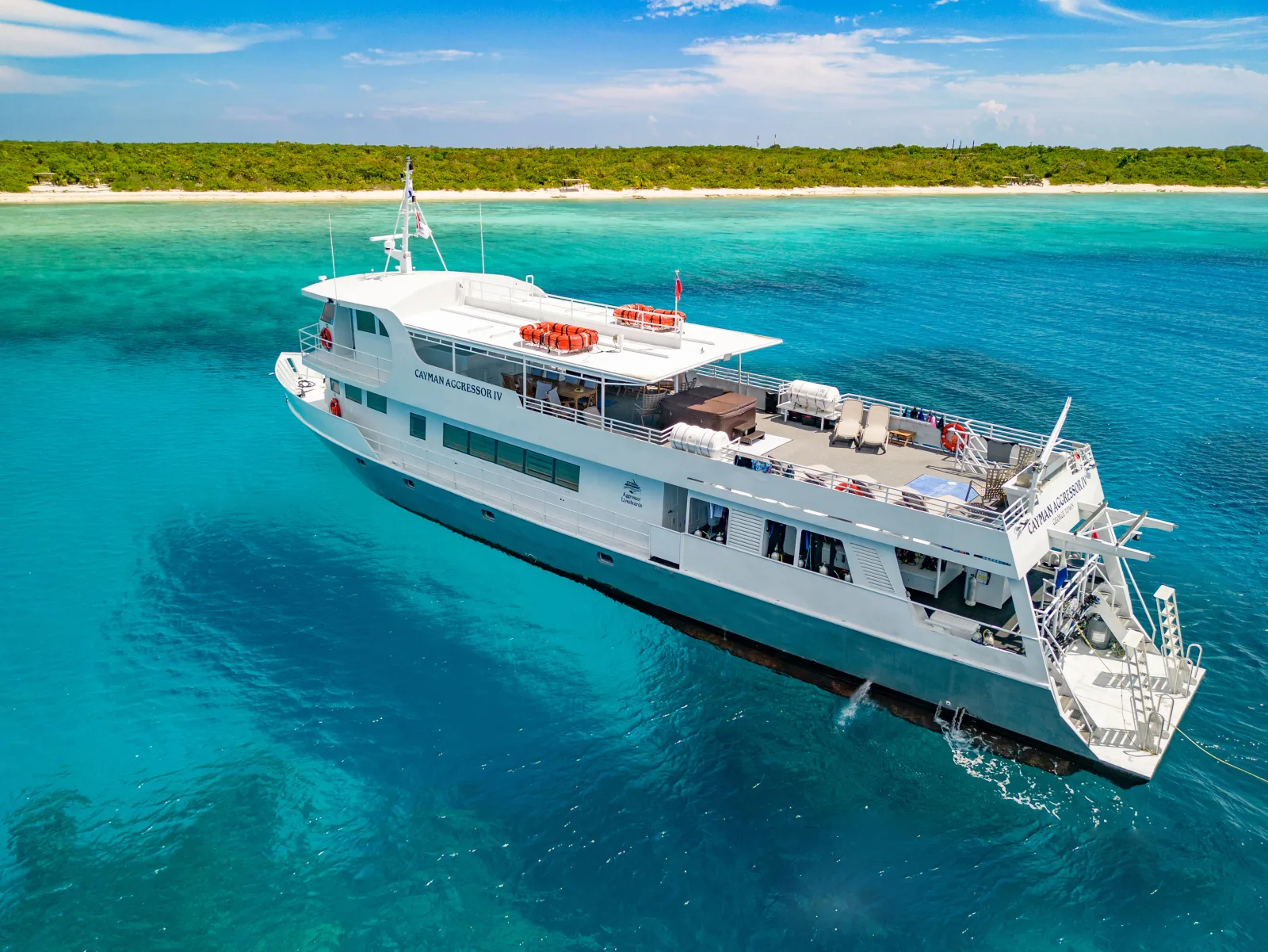 Cayman Aggressor IV from above showing the sun deck with hot tub and loungers