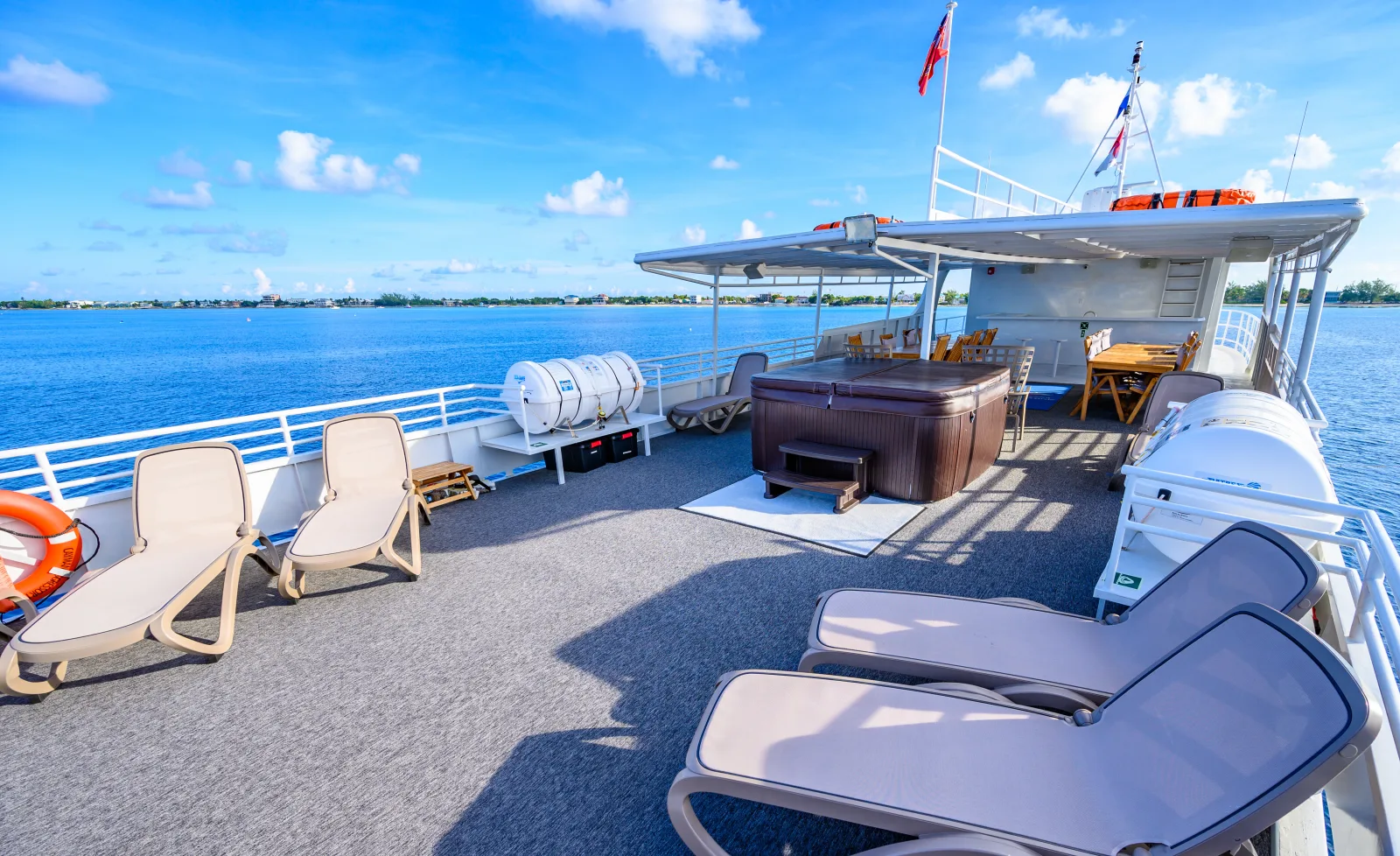 Sun deck of Cayman Aggressor IV with hot tub and loungers