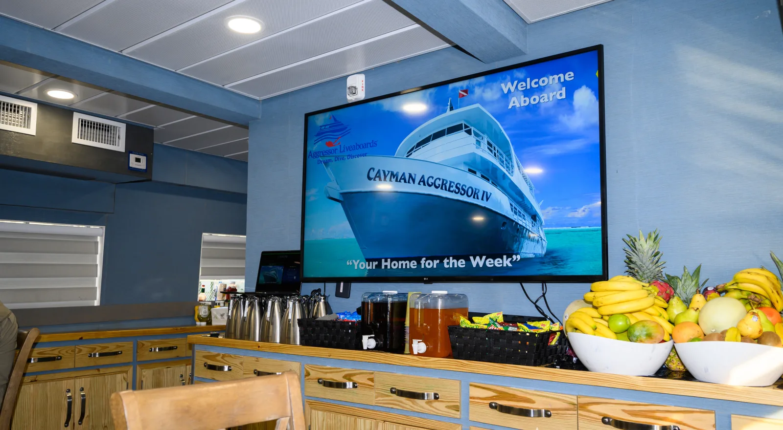 Welcome screen in the salon of Cayman Aggressor IV