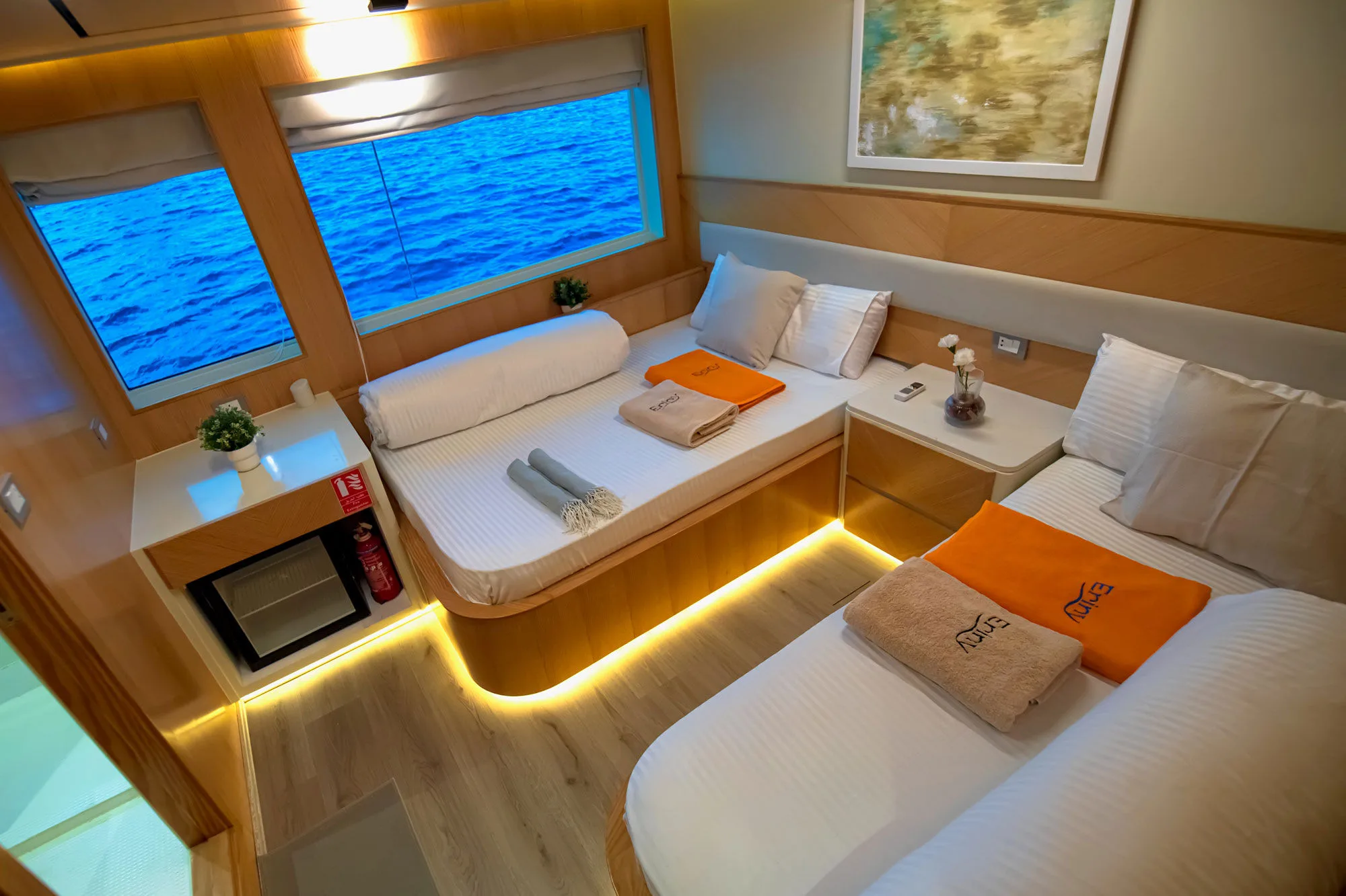 Twin cabin on Eriny — sea view through two windows above the bed