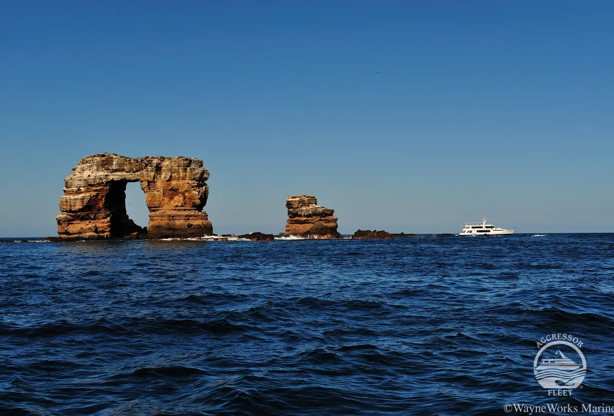 Darwin Island with the yacht on the horizon