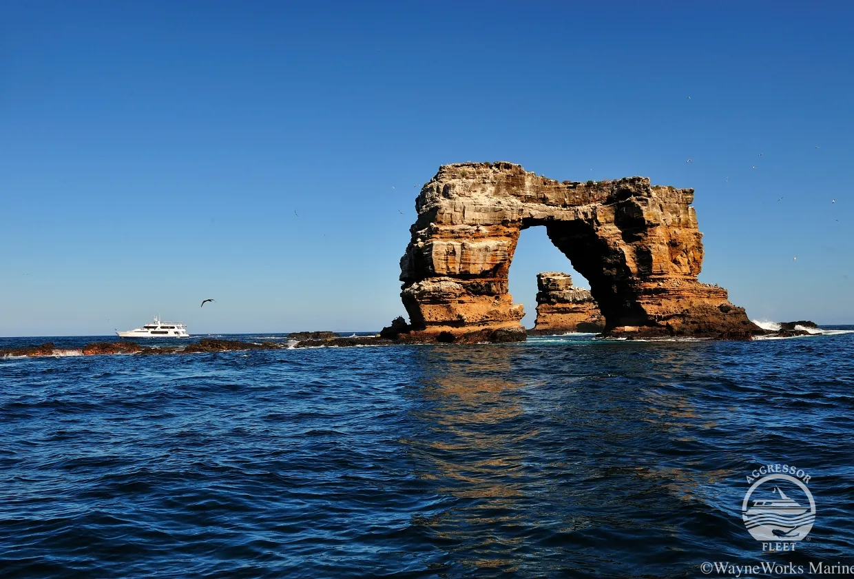 Darwin's Arch and Galapagos Aggressor III in morning light