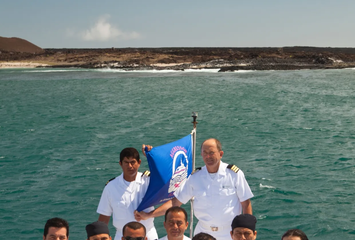 Crew of Galapagos Aggressor III with the flag on deck