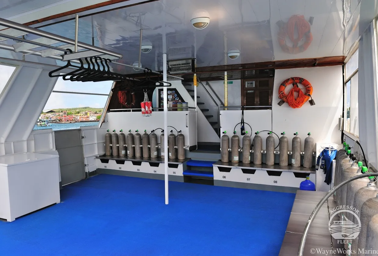 Dive deck of Galapagos Aggressor III with rows of tanks