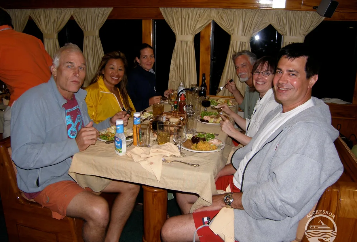 Guests around the communal table in the saloon