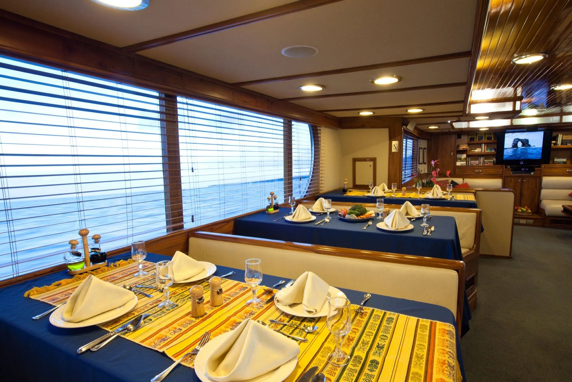 Laid tables in the dining room of Galapagos Aggressor III