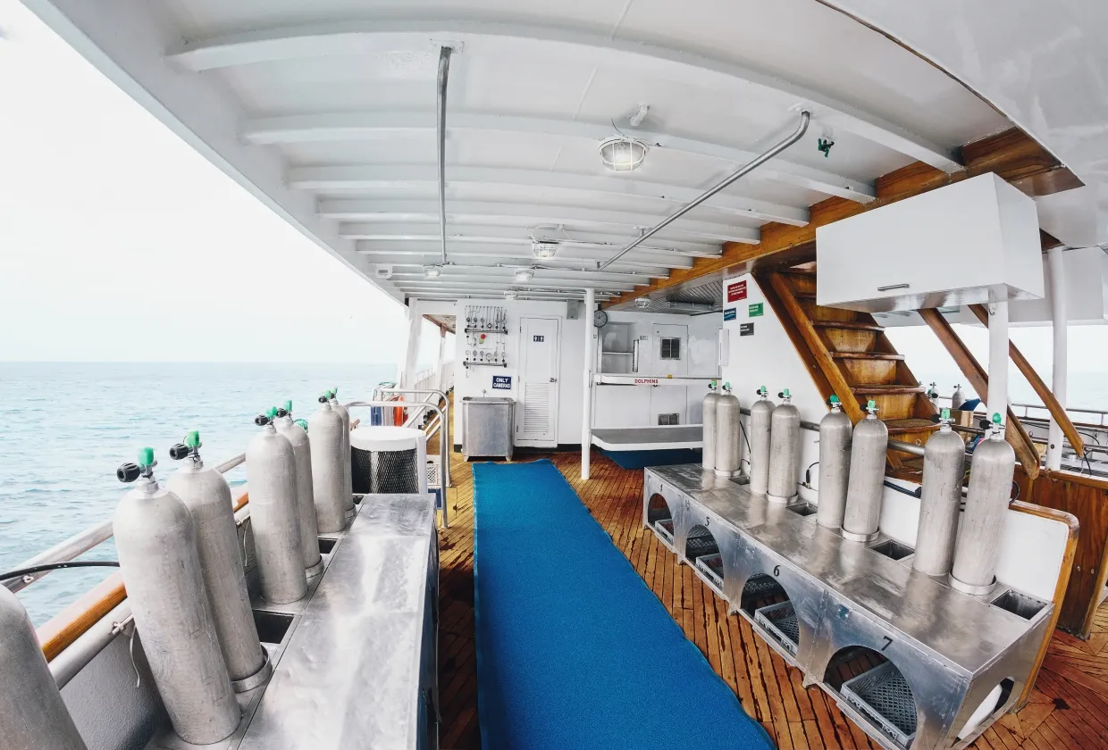 Gear laid out in stations on the dive deck of Galapagos Sky