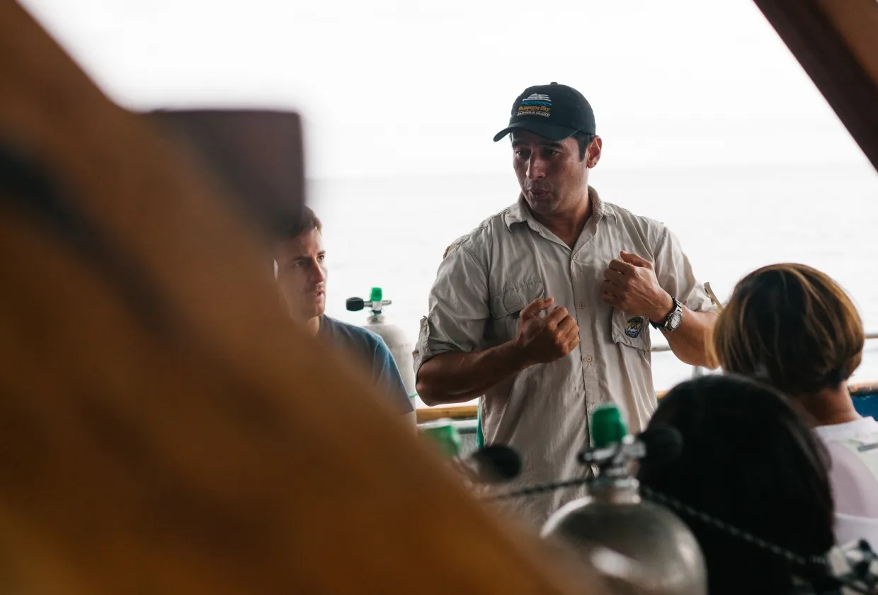 Pre-dive briefing on the deck of Galapagos Sky