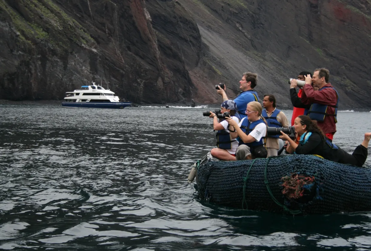 Panga beneath the sheer cliffs of Wolf Island