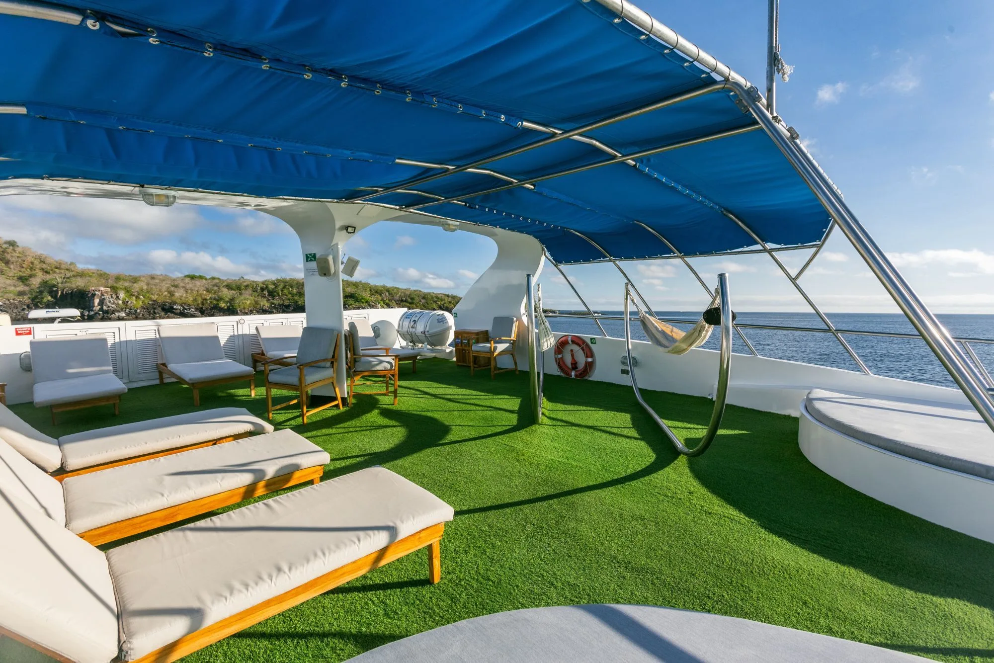Sun deck of Galapagos Sky with loungers