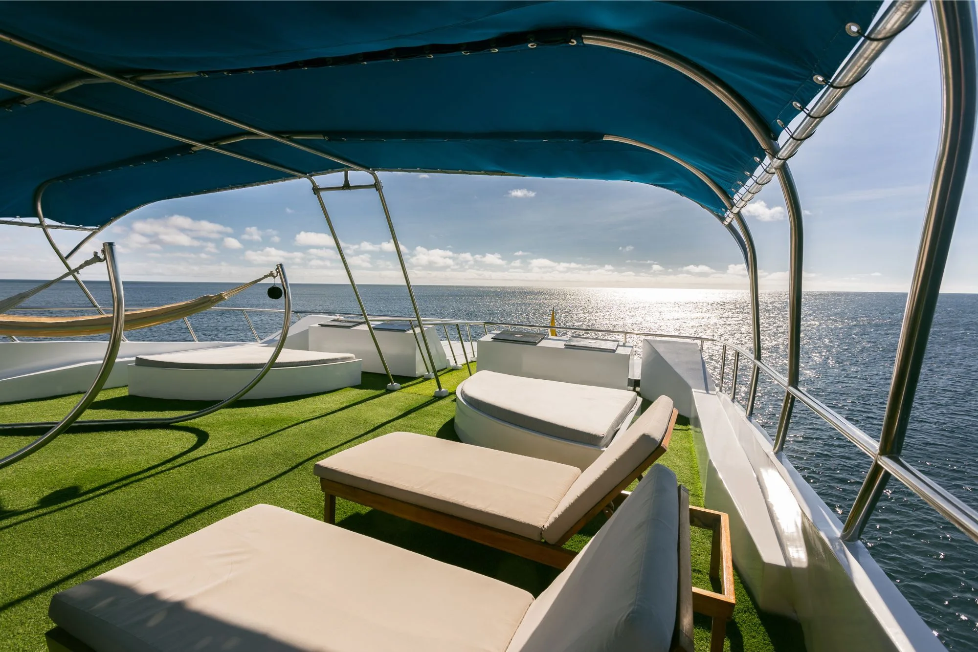 Loungers and awning on the upper deck of Galapagos Sky