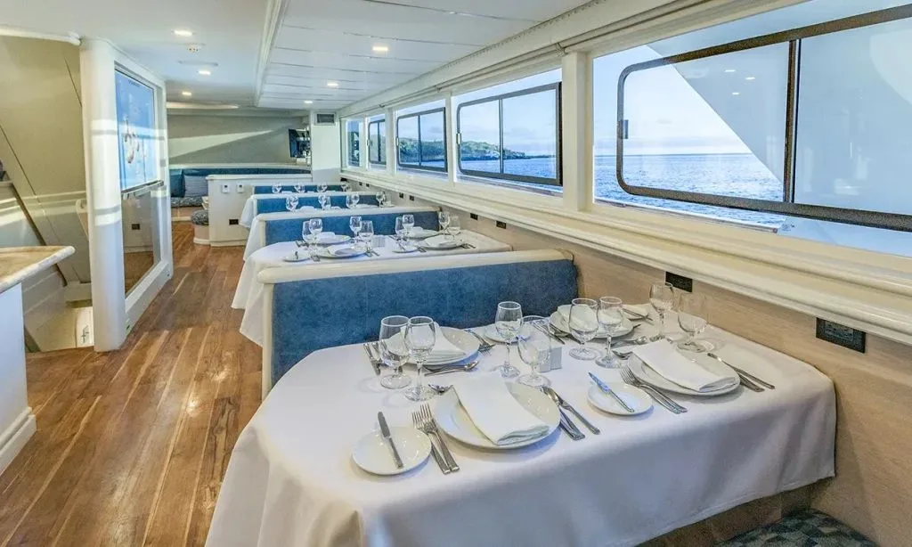 Dining room of Galapagos Sky with set tables
