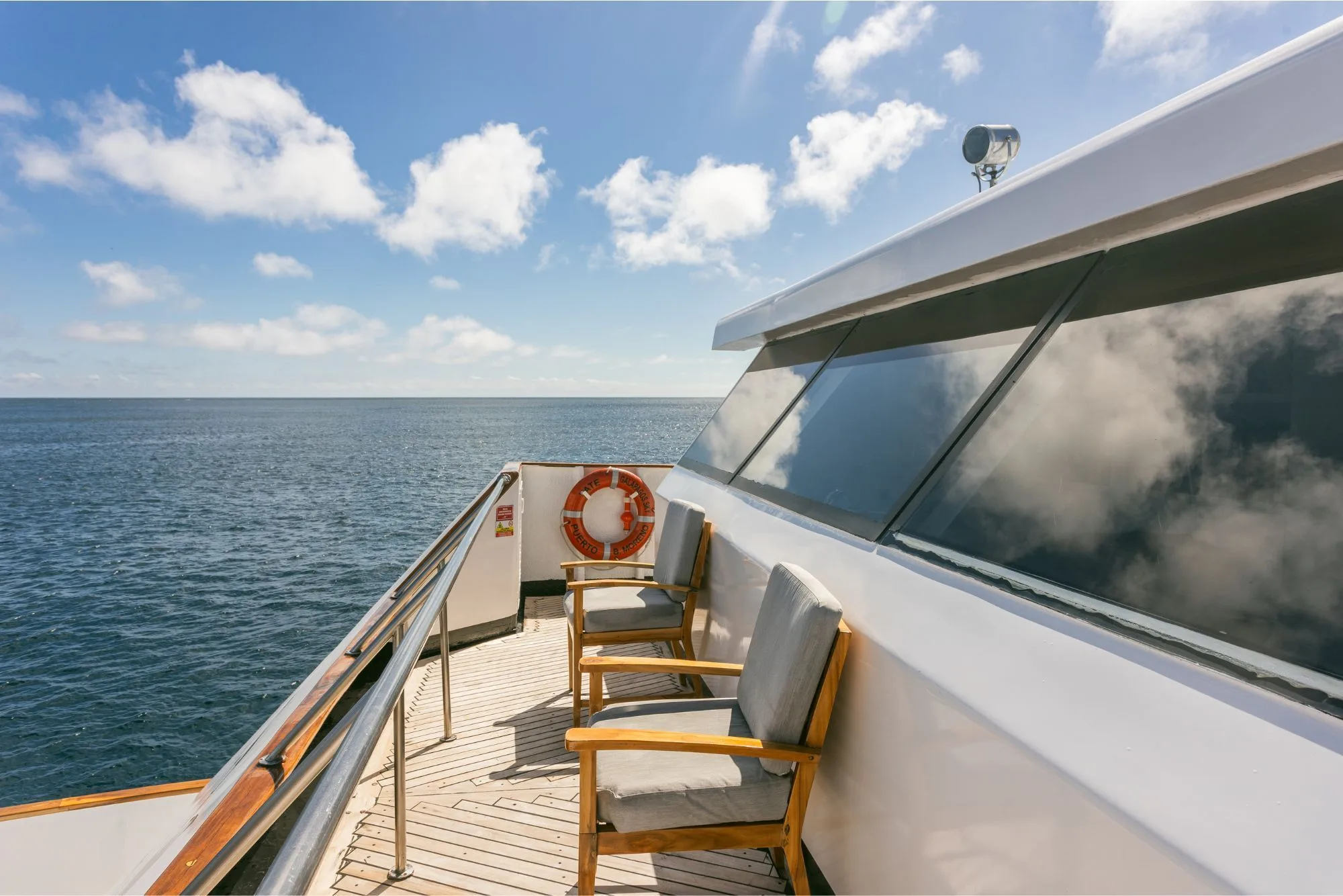 Side deck of Galapagos Sky with a life ring