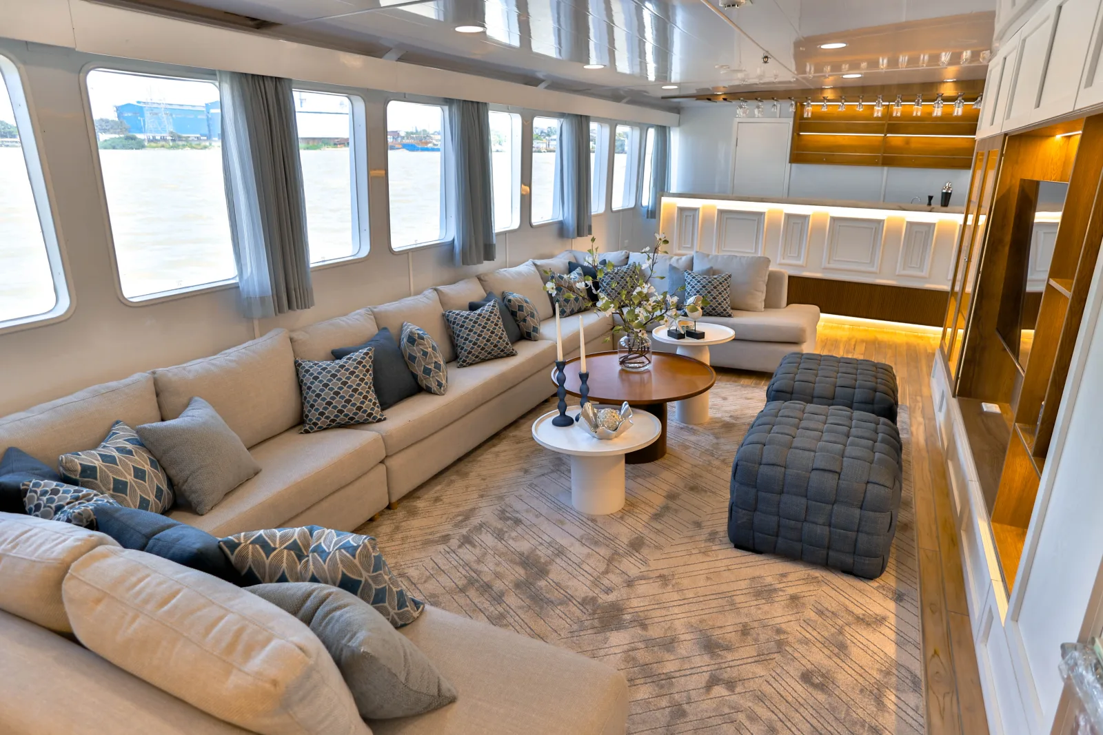 Saloon of Galaxy Diver II with a corner sofa running its full length
