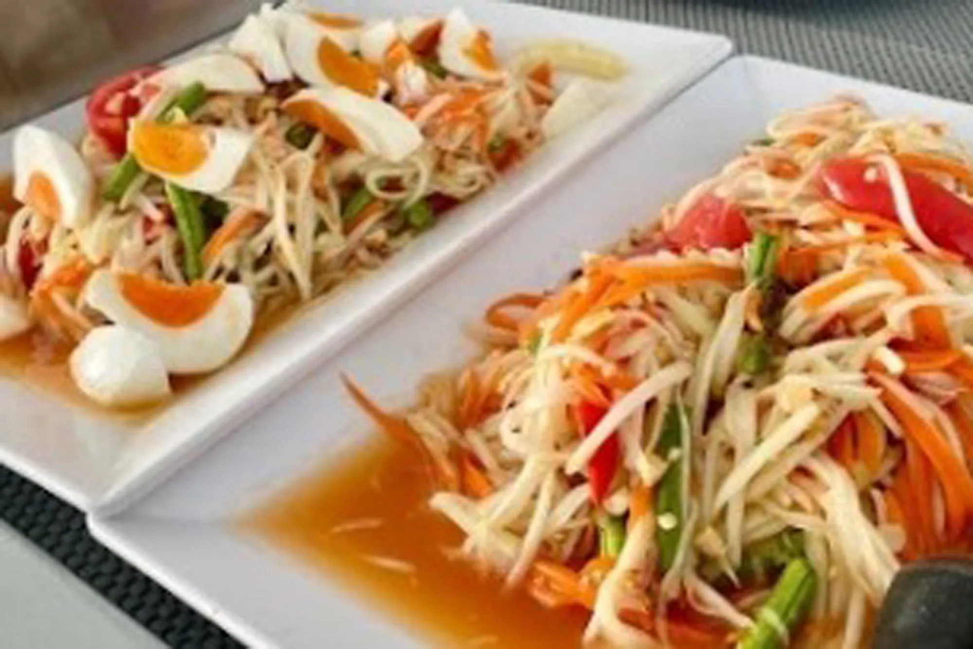 Thai som tam salad served on Krishna 3