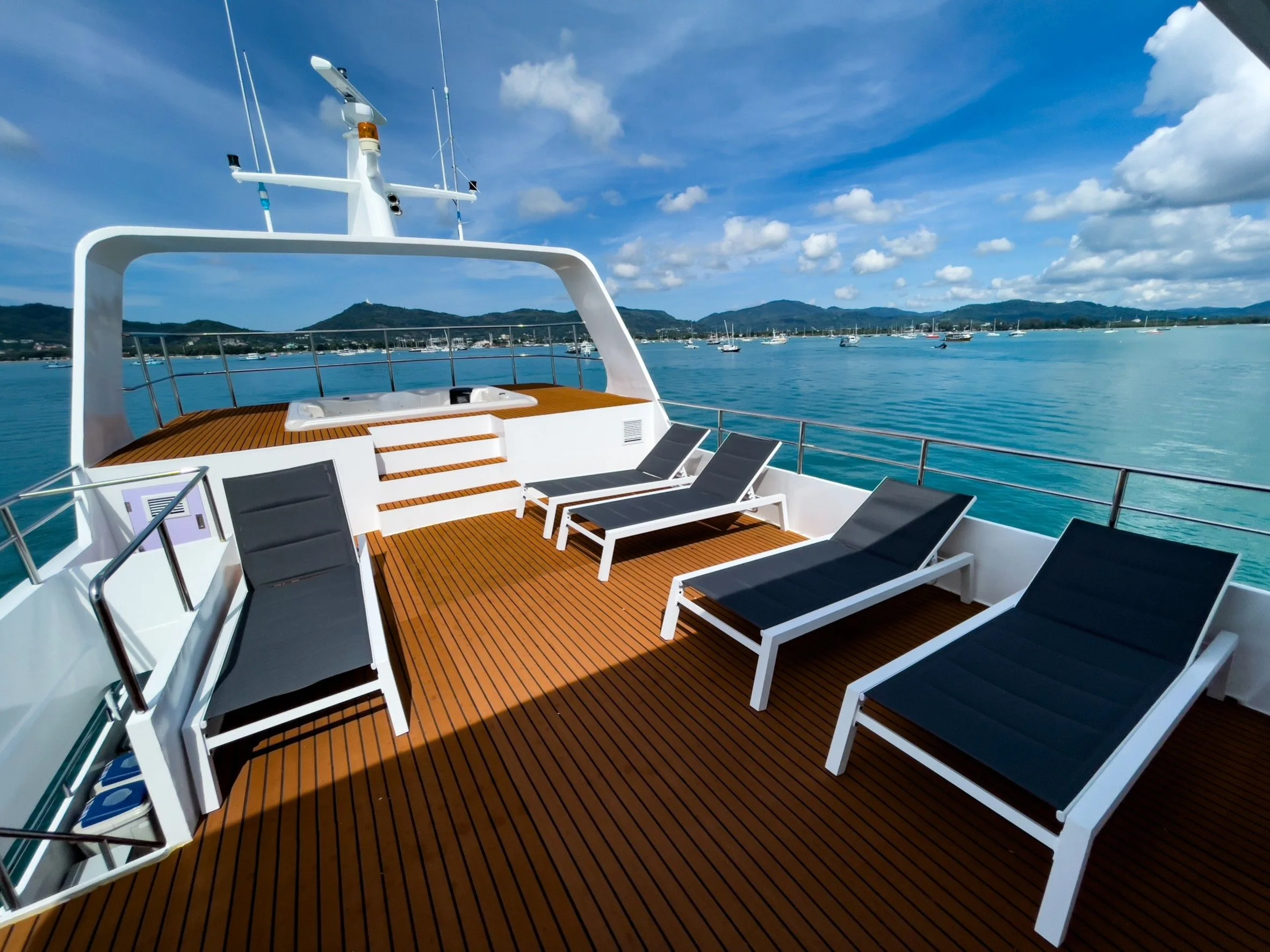 Loungers on the upper deck above turquoise water