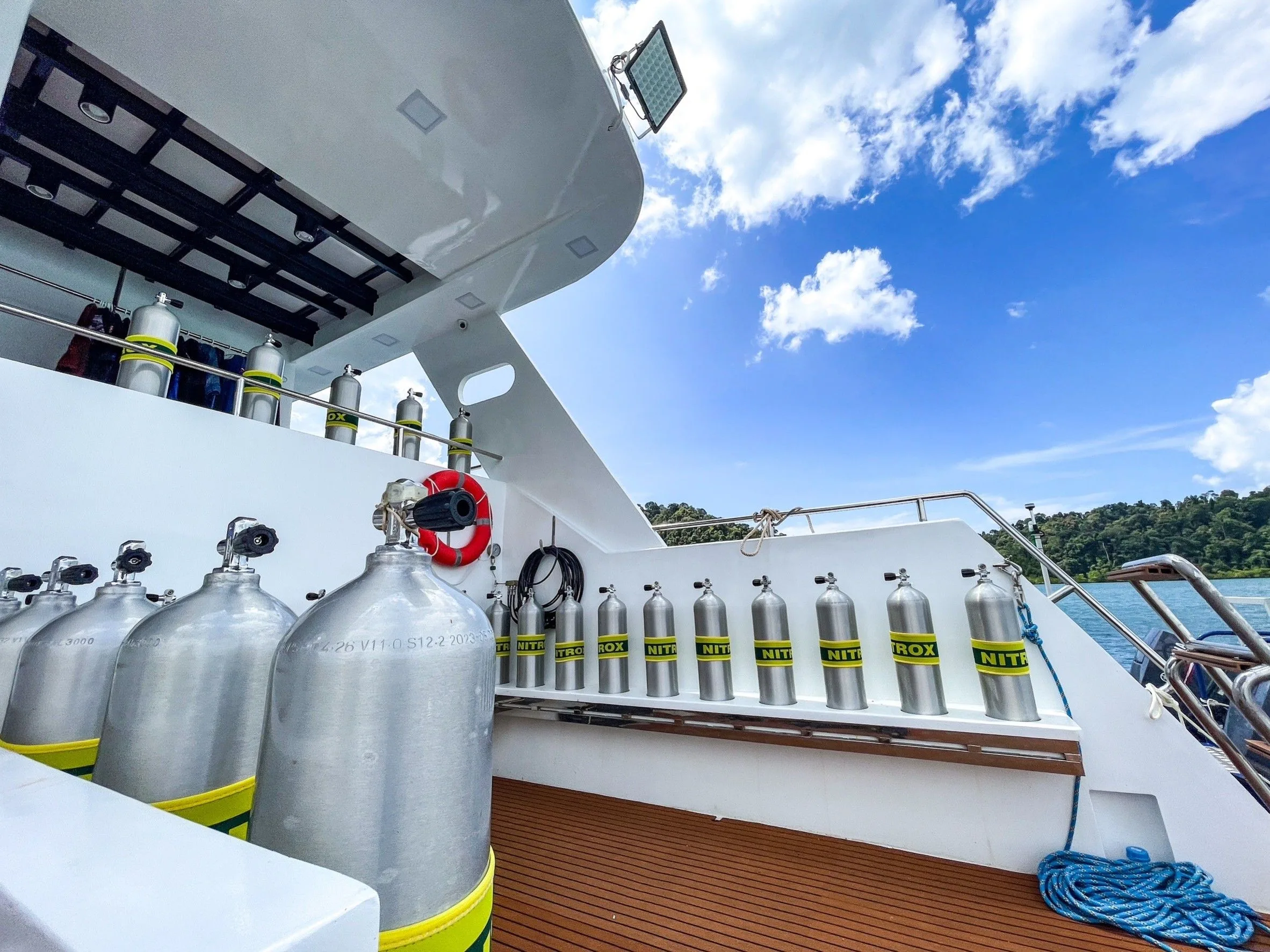 Dive deck of Mandarin Queen 9 with rows of aluminium tanks