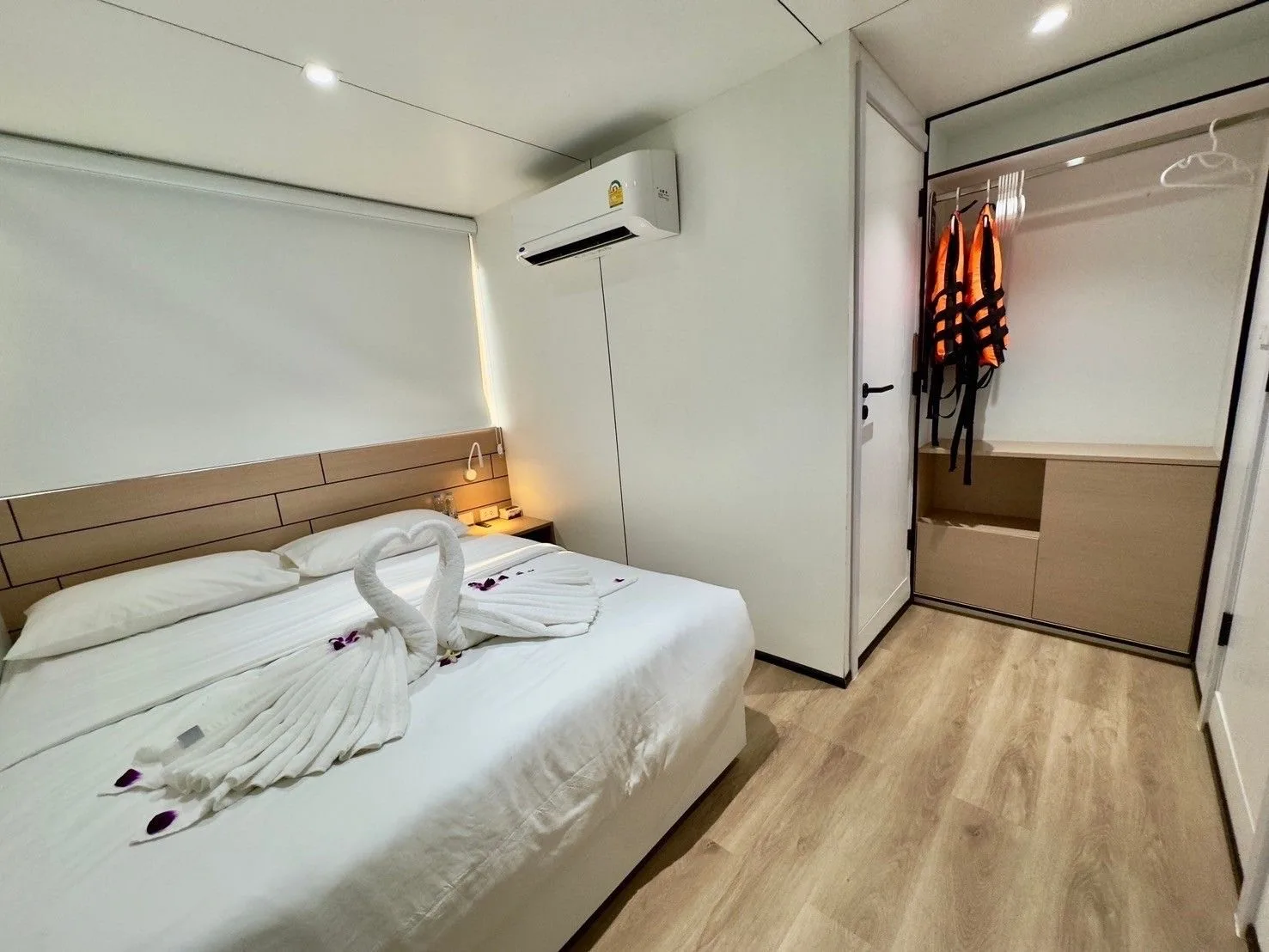 Lower deck master cabin with a wardrobe and life jackets