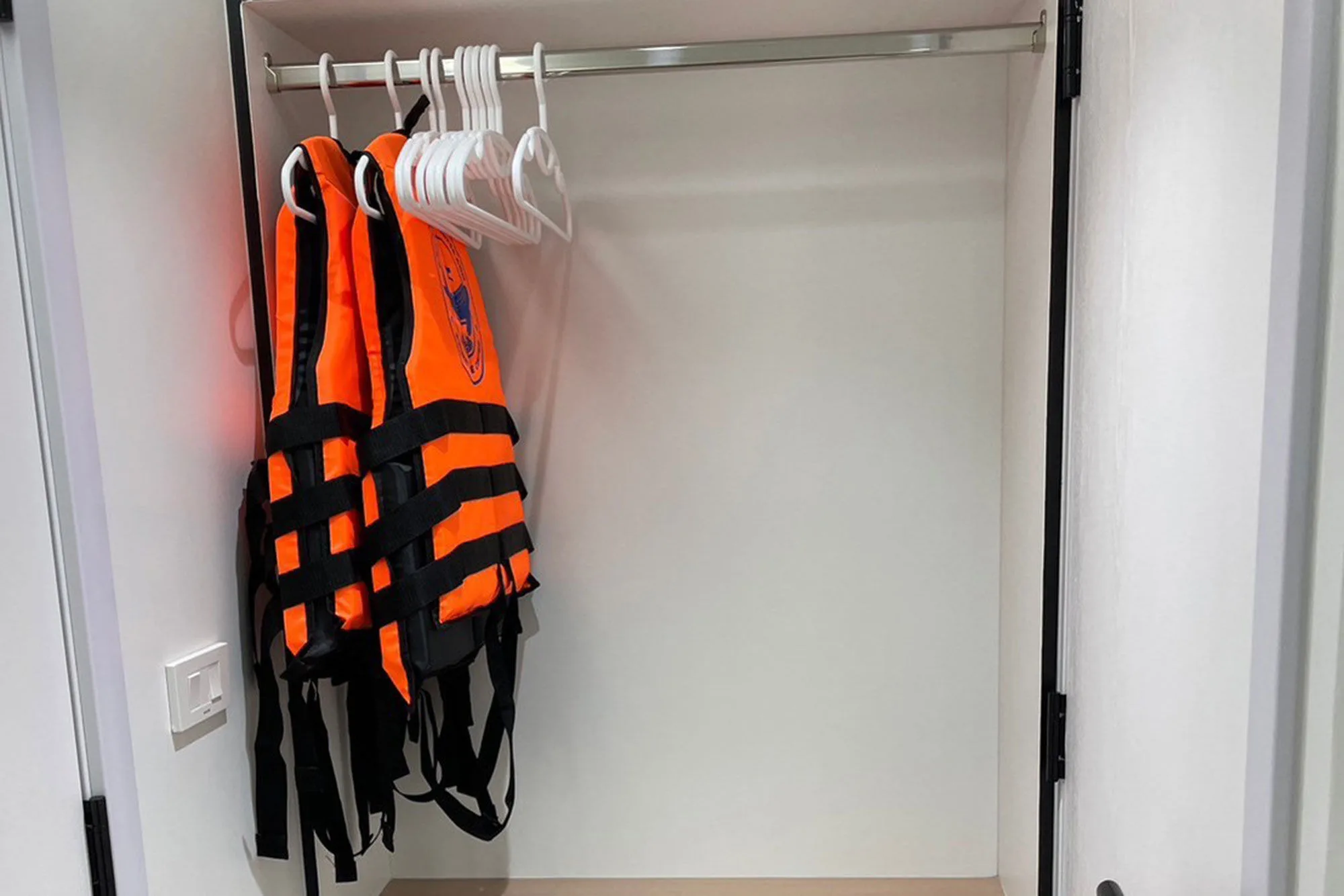 Cabin wardrobe with life jackets and hangers