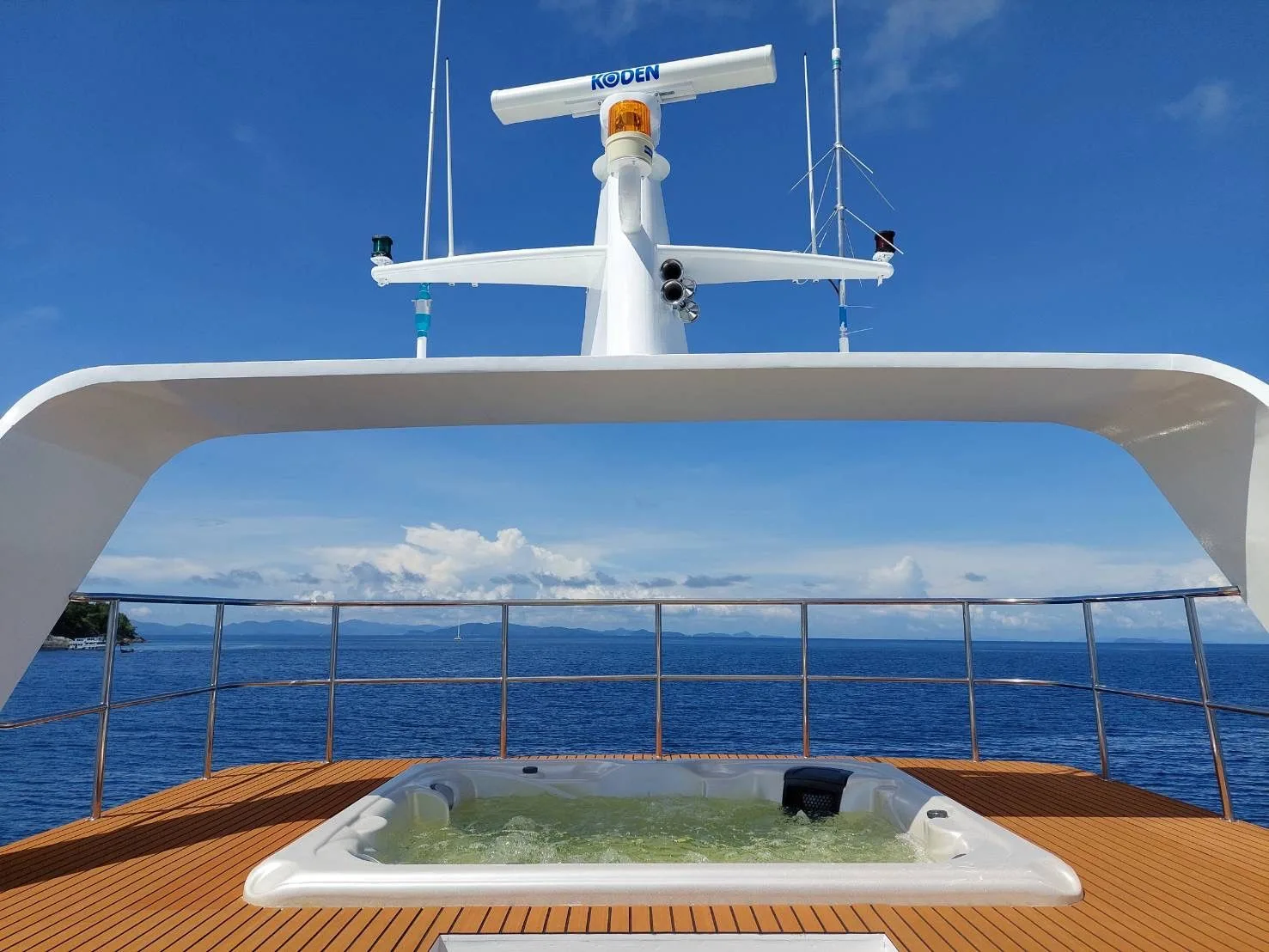 Sun deck with the jacuzzi under the radar mast