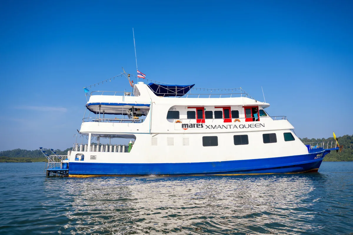 Manta Queen 2 in profile — three decks and a blue waterline