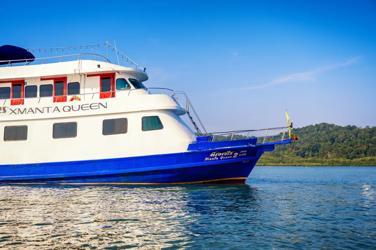 Close-up of the bow of Manta Queen 2 with her name on the hull