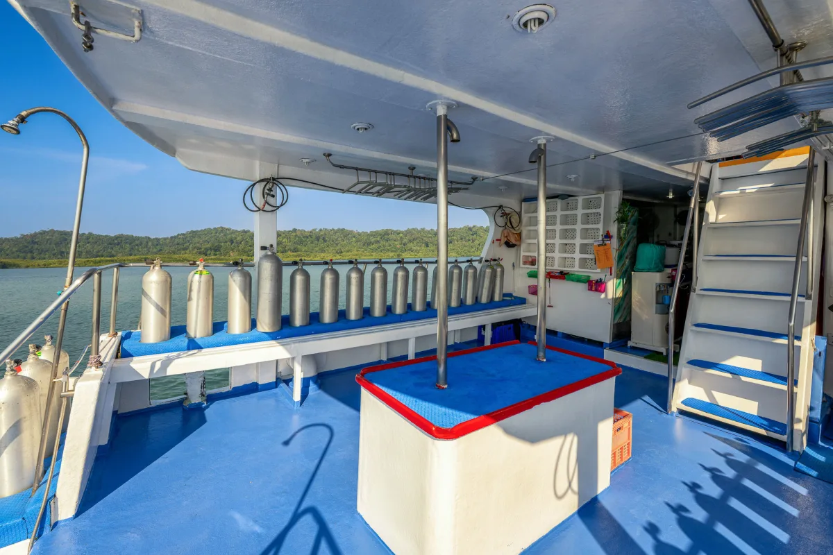 Dive deck of Manta Queen 2 — tanks along both sides and space to kit up
