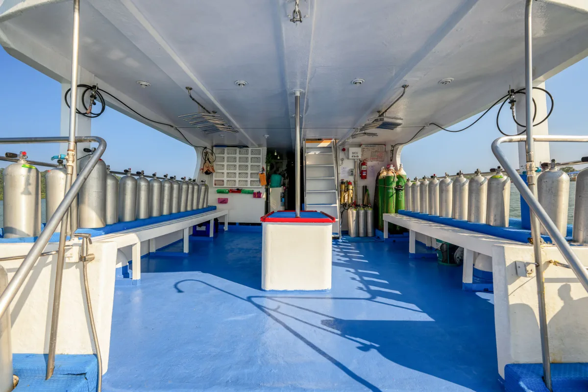 Spacious blue-floored dive deck on Manta Queen 2