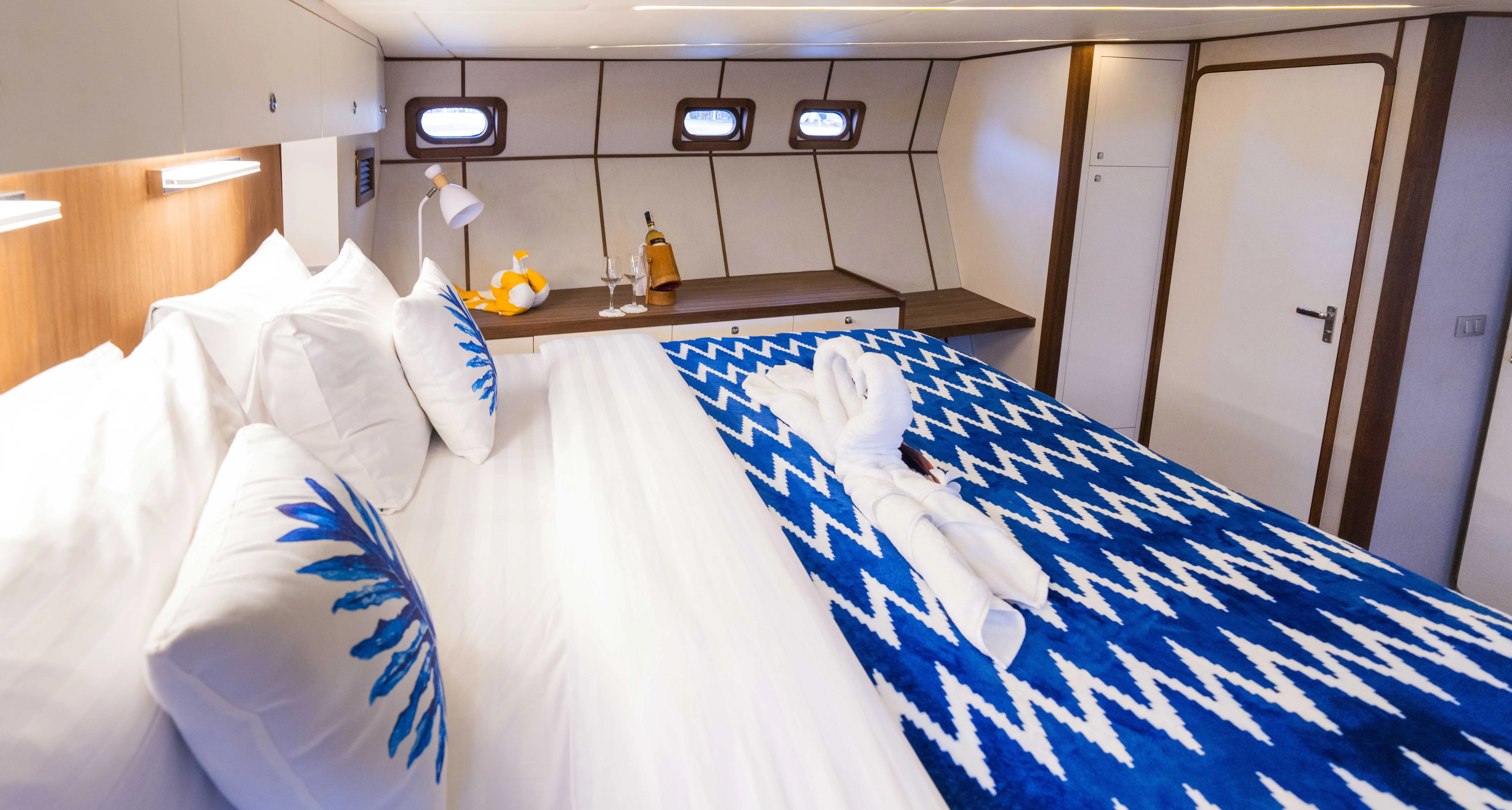 Headboard and reading lamps in the master cabin of M.Y. Gypsy
